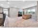 Open loft space with TV, comfortable seating, and large windows at 708 Fox Edge Ct, Oviedo, FL 32765
