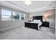Spacious main bedroom with a king-size bed and large windows at 708 Fox Edge Ct, Oviedo, FL 32765