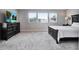 Bright main bedroom with a king-size bed and dresser at 708 Fox Edge Ct, Oviedo, FL 32765