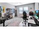 Spacious home office with large desk, comfortable chair, and ample shelving at 708 Fox Edge Ct, Oviedo, FL 32765
