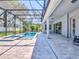 Large, screened pool and spa with expansive patio and backyard view at 708 Fox Edge Ct, Oviedo, FL 32765