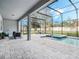 Relaxing pool and spa area with covered patio and lush landscaping at 708 Fox Edge Ct, Oviedo, FL 32765
