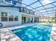 Inviting pool area with a screened enclosure and spacious patio at 708 Fox Edge Ct, Oviedo, FL 32765