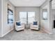 Tranquil sitting area, perfect for relaxing with two armchairs and art at 708 Fox Edge Ct, Oviedo, FL 32765
