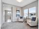 Cozy sitting area with two armchairs, side table, and natural light at 708 Fox Edge Ct, Oviedo, FL 32765