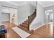 Elegant staircase with dark wood steps and an ornate metal railing at 708 Fox Edge Ct, Oviedo, FL 32765