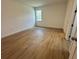 Simple bedroom with wood-look floors and a window at 6807 Sw 153Rd Place Rd # 6807, Ocala, FL 34473