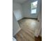 Bedroom with wood-look floors and window at 6807 Sw 153Rd Place Rd # 6807, Ocala, FL 34473
