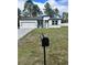 Two-story house with a gray and white exterior, and a landscaped lawn at 6807 Sw 153Rd Place Rd # 6807, Ocala, FL 34473