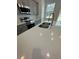 White quartz countertop with under-cabinet lighting in modern kitchen at 6807 Sw 153Rd Place Rd # 6807, Ocala, FL 34473