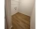 Laundry room with wire shelving and wood-look floors at 6807 Sw 153Rd Place Rd # 6807, Ocala, FL 34473