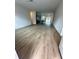 Spacious living room with wood-look vinyl flooring at 6807 Sw 153Rd Place Rd # 6807, Ocala, FL 34473