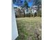 Side yard with a view of the woods at 6807 Sw 153Rd Place Rd # 6807, Ocala, FL 34473