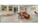 Spacious finished basement area with tile floors, ample seating, and natural light at 2524 Dellwood Dr, Orlando, FL 32806