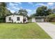 Charming single-story home with well-maintained landscaping and a covered carport at 2524 Dellwood Dr, Orlando, FL 32806