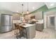 Spacious kitchen featuring stainless steel appliances, a central island, and modern cabinetry at 2524 Dellwood Dr, Orlando, FL 32806