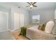 Bright main bedroom featuring a large bed, ceiling fan, ample natural light, and a neutral color palette at 2524 Dellwood Dr, Orlando, FL 32806