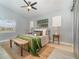 Cozy bedroom featuring a stylish bed, a ceiling fan, and wood-look tile flooring at 2524 Dellwood Dr, Orlando, FL 32806