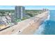 Aerial view of beachfront property with ocean, beach, and high-rise building at 1404 N Atlantic Ave # 4, Daytona Beach, FL 32118