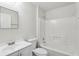 Clean bathroom with a shower-tub combo, toilet, and modern sink at 610 Walker St, Holly Hill, FL 32117