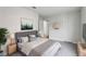 Comfortable bedroom with a plush rug, soft lighting, and soothing wall art at 610 Walker St, Holly Hill, FL 32117