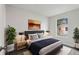 Bedroom featuring neutral decor, two bedside tables, and a large window at 610 Walker St, Holly Hill, FL 32117