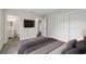 Well-lit bedroom with a closet, TV, and neutral decor at 610 Walker St, Holly Hill, FL 32117