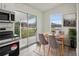 Cozy dining area with a wooden table, seating for four, and slider door at 610 Walker St, Holly Hill, FL 32117