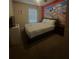 A nicely decorated bedroom features a themed mural and full size bed at 8531 Bay Lilly Loop, Kissimmee, FL 34747