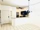 Open kitchen view with dark cabinets, granite countertop, and bar seating, adjacent to the dining area at 8531 Bay Lilly Loop, Kissimmee, FL 34747