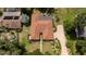 Aerial view of a charming single-Gathering home with a well-manicured yard and mature trees at 1546 Stormway Ct, Apopka, FL 32712