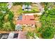 Aerial view shows a well-maintained home with lush landscaping and a spacious backyard, ideal for outdoor living at 1546 Stormway Ct, Apopka, FL 32712