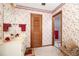 Bathroom featuring patterned wallpaper, single sink vanity, and adjacent shower room for a functional layout at 1546 Stormway Ct, Apopka, FL 32712