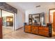 Bedroom showing dresser with mirror, view into living room, and glass doors to the enclosed patio at 1546 Stormway Ct, Apopka, FL 32712