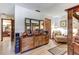 Bedroom view shows a blend of elegant furnishings, including a dresser and four poster bed, under neutral lighting at 1546 Stormway Ct, Apopka, FL 32712