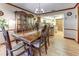 Dining room open to kitchen with wood table and chairs at 1546 Stormway Ct, Apopka, FL 32712