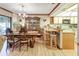 Dining room that flows into the kitchen with hardwood floors at 1546 Stormway Ct, Apopka, FL 32712