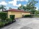View of the home's side, showing the two car garage and mature landscaping at 1546 Stormway Ct, Apopka, FL 32712