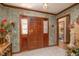 Charming foyer with decorative wallpaper, wood trim, and a view into the home's interior at 1546 Stormway Ct, Apopka, FL 32712