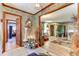Charming foyer with wood floors transitions into the living spaces, offering an inviting view of the home's interior at 1546 Stormway Ct, Apopka, FL 32712