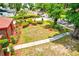Well-manicured front yard featuring lush green grass, neatly trimmed hedges, and a charming walkway to the home at 1546 Stormway Ct, Apopka, FL 32712