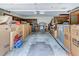Spacious garage interior, filled with organized storage boxes and household items, ready for your vehicles and projects at 1546 Stormway Ct, Apopka, FL 32712