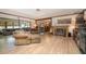 Inviting living room with a fireplace, plush seating, and open layout to the dining area at 1546 Stormway Ct, Apopka, FL 32712