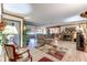 Open living room with fireplace, lots of seating and wood look floors at 1546 Stormway Ct, Apopka, FL 32712
