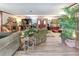 Spacious living room with a fireplace, hardwood floors, and a large plant at 1546 Stormway Ct, Apopka, FL 32712