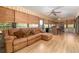 Relaxing sunroom with a comfortable couch, bamboo blinds, and natural light at 1546 Stormway Ct, Apopka, FL 32712