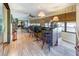Bright sunroom with wood-look floors, built-in bar area, and views to the outside at 1546 Stormway Ct, Apopka, FL 32712