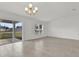 Bright living room featuring tiled floors, lots of natural light, and backyard views at 3409 Narrows Dr, Lakeland, FL 33810