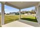 Covered patio overlooking a green lawn and neighborhood homes at 3409 Narrows Dr, Lakeland, FL 33810