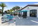 Exterior of the community bar and lounge showcasing outdoor seating and umbrellas for guests at 2428 Dubai St, Kissimmee, FL 34747